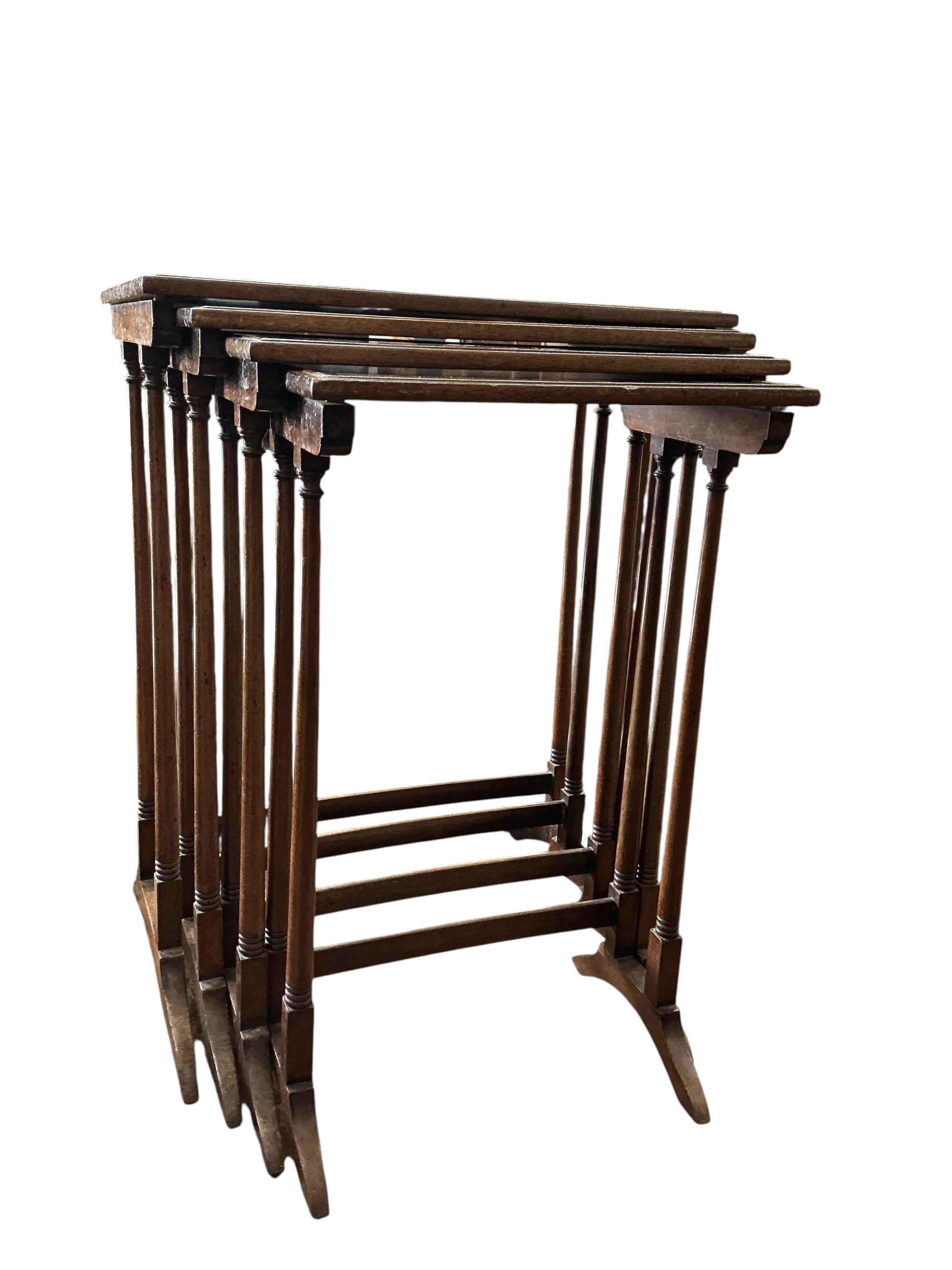 A quartetto of Edwardian rectangular mahogany tables, width 53cm, depth 36cm, height 70cm together with a George III style mahogany toilet mirror